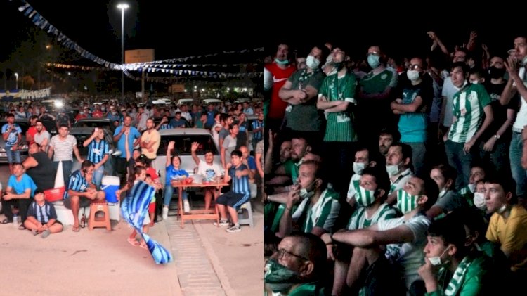 Koronavirüs nedeniyle stada alınmayan taraftarlar dışarıda iç içe maç izledi