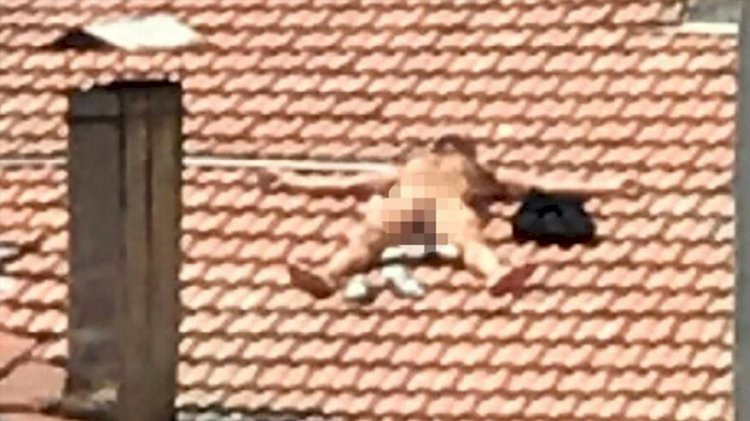 Burdur'da çatıda çıplak yatan kişi gözaltına alındı